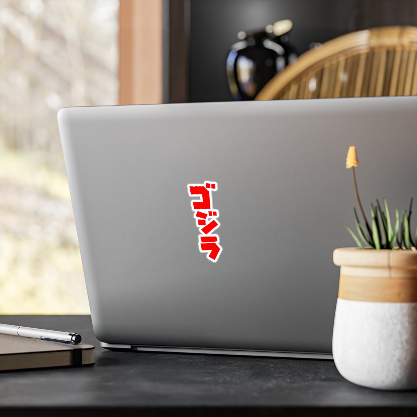 Godzilla vinyl sticker applied to laptop — perfect for customizing tech or gear